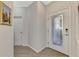View of entryway with interior door and wood flooring at 9855 Haze Dr, Venice, FL 34292