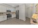 Modern kitchen with stainless steel appliances and granite countertops at 9855 Haze Dr, Venice, FL 34292