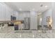 Modern kitchen with stainless steel appliances and granite countertops at 9855 Haze Dr, Venice, FL 34292