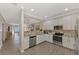 Modern kitchen featuring stainless steel appliances and granite countertops at 9855 Haze Dr, Venice, FL 34292