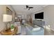 Spacious living room with seating and open floor plan at 9855 Haze Dr, Venice, FL 34292