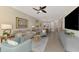 Living area with comfortable seating and a view to the dining area at 9855 Haze Dr, Venice, FL 34292