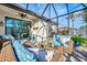 Outdoor patio with seating area and view of backyard at 9855 Haze Dr, Venice, FL 34292
