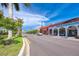Picturesque street lined with shops and palm trees at 9855 Haze Dr, Venice, FL 34292