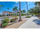 Scenic street view with shops and lush landscaping at 9855 Haze Dr, Venice, FL 34292