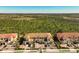 Aerial view of a townhome community with lush landscaping at 10055 Crooked Creek Dr # 102, Venice, FL 34293