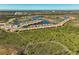 Aerial view of a large community with houses, lakes, and lush vegetation at 10055 Crooked Creek Dr # 102, Venice, FL 34293