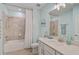 Light and airy bathroom with a shower/tub combo and modern vanity at 10055 Crooked Creek Dr # 102, Venice, FL 34293
