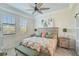 Spacious bedroom with king-size bed, wood-like floors and large windows at 10055 Crooked Creek Dr # 102, Venice, FL 34293