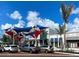 Vibrant community plaza with shade structures and parking at 10055 Crooked Creek Dr # 102, Venice, FL 34293