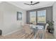 Elegant dining area featuring a glass top table and neutral decor at 10055 Crooked Creek Dr # 102, Venice, FL 34293