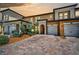 Townhome with two-car garage and brick paver driveway at 10055 Crooked Creek Dr # 102, Venice, FL 34293