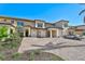 Luxury townhome with paver driveway and two-car garage at 10055 Crooked Creek Dr # 102, Venice, FL 34293