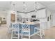Modern kitchen with white cabinets, island, and stainless steel appliances at 10055 Crooked Creek Dr # 102, Venice, FL 34293