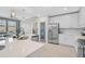 Modern kitchen with white cabinets and stainless steel appliances at 10055 Crooked Creek Dr # 102, Venice, FL 34293