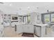 Open concept kitchen with island and stainless steel appliances at 10055 Crooked Creek Dr # 102, Venice, FL 34293
