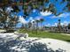 Community playground with climbing ropes and slides at 10055 Crooked Creek Dr # 102, Venice, FL 34293