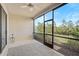 Relaxing screened patio with ceiling fan and view of nature at 10055 Crooked Creek Dr # 102, Venice, FL 34293