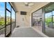 Screened patio with view of kitchen and lush greenery at 10055 Crooked Creek Dr # 102, Venice, FL 34293