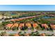 Aerial view of house and surrounding neighborhood at 115 Avalini Way, North Venice, FL 34275