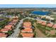 Aerial view of a luxurious community with single-Gathering homes and a golf course at 115 Avalini Way, North Venice, FL 34275