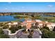 Community clubhouse with a golf course view at 115 Avalini Way, North Venice, FL 34275