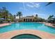 Inviting community pool with a hot tub and plenty of seating at 115 Avalini Way, North Venice, FL 34275
