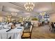 Bright dining room with multiple tables and chairs at 115 Avalini Way, North Venice, FL 34275