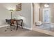 Home office space with a desk and chair near the entryway at 115 Avalini Way, North Venice, FL 34275