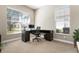 Spacious home office with a corner desk and large windows at 115 Avalini Way, North Venice, FL 34275