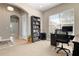 Bright home office with built-in shelving and plenty of natural light at 115 Avalini Way, North Venice, FL 34275