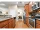 Modern kitchen with stainless steel appliances and granite countertops at 115 Avalini Way, North Venice, FL 34275