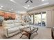 Living Room with access to the kitchen and patio at 115 Avalini Way, North Venice, FL 34275