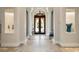 Elegant lobby with high ceilings and columns at 115 Avalini Way, North Venice, FL 34275