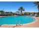 Relaxing resort-style pool with a swim-up bar and lounge area at 115 Avalini Way, North Venice, FL 34275