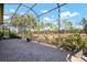 Screened patio overlooking a backyard at 115 Avalini Way, North Venice, FL 34275