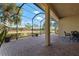 Spacious screened patio with pavers and seating area at 115 Avalini Way, North Venice, FL 34275