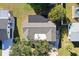 Top-down view of a single-Gathering home with a gray roof and a spacious backyard at 1313 Cypress Ave, Venice, FL 34285