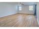 Large bedroom with hardwood floors and two windows at 1358 Leawood Rd, Englewood, FL 34223