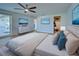 Bright bedroom with a king-size bed and large windows at 1358 Leawood Rd, Englewood, FL 34223