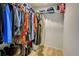 Walk-in closet with ample shelving and hanging space at 1358 Leawood Rd, Englewood, FL 34223