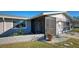 Screened porch entrance with brick planter at 1358 Leawood Rd, Englewood, FL 34223