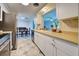 Kitchen with white cabinets and stainless steel appliances at 1358 Leawood Rd, Englewood, FL 34223