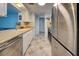 Bright kitchen, stainless steel appliances, and tiled floor at 1358 Leawood Rd, Englewood, FL 34223