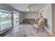 Living room with sliding doors leading to pool area at 1358 Leawood Rd, Englewood, FL 34223