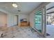Living area featuring tiled floors and sliding glass doors at 1358 Leawood Rd, Englewood, FL 34223