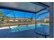 Inviting screened pool with ample patio space at 1358 Leawood Rd, Englewood, FL 34223