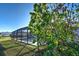 Relaxing screened-in pool and backyard at 1358 Leawood Rd, Englewood, FL 34223