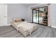 Serene bedroom with a chaise lounge and sliding glass doors leading to the pool at 1363 Brookside Dr, Venice, FL 34285