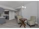 Cozy dining area with two armchairs and a small wooden table at 1363 Brookside Dr, Venice, FL 34285